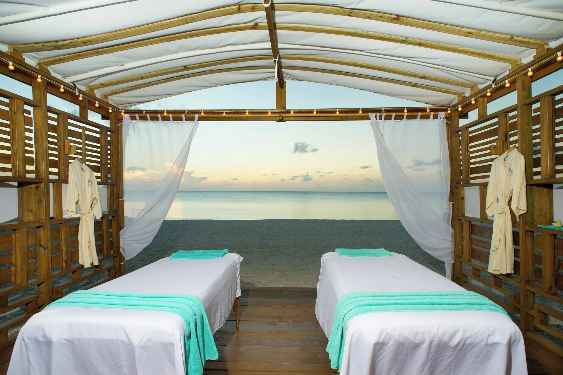 Two massage tables in a beachfront spa cabana at The Westin Grand Cayman Seven Mile Beach Resort & Spa.