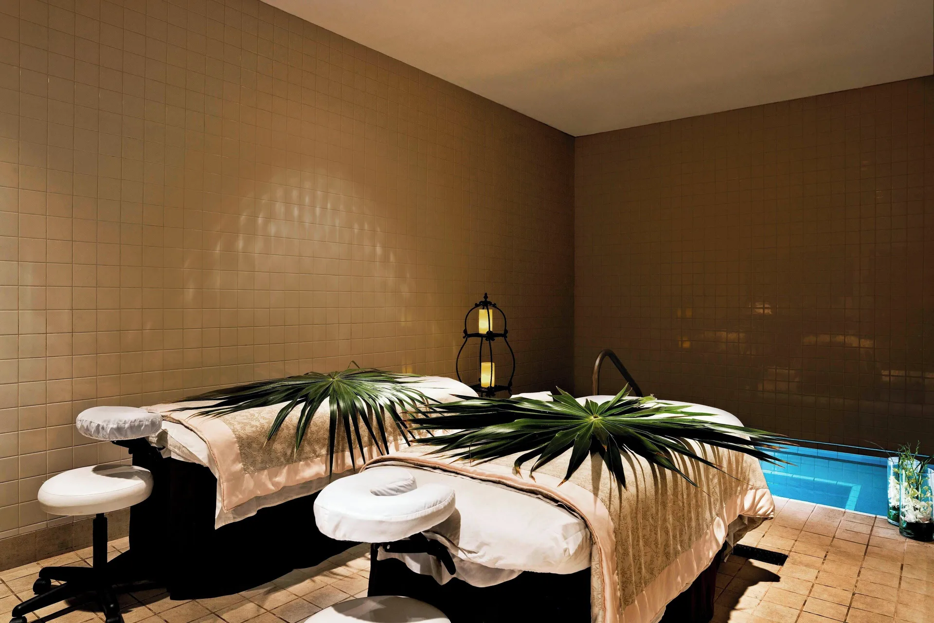 Couples treatment beds by a soaking pool at The Westin Grand Cayman Seven Mile Beach Resort & Spa.