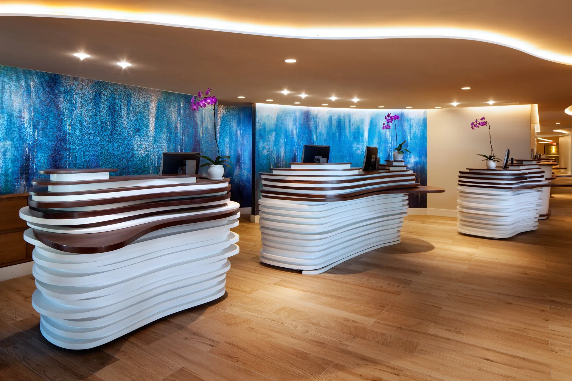 Curved front desks in the lobby at The Westin Grand Cayman Seven Mile Beach Resort & Spa.