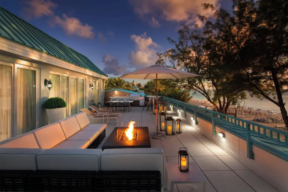 Terrace fire pit and beach view at The Westin Grand Cayman Seven Mile Beach Resort & Spa.