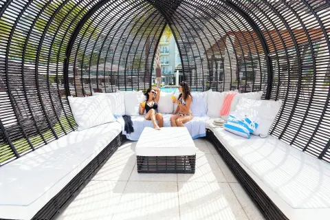 Shaded wicker lounge cabana at The Westin Grand Cayman Seven Mile Beach Resort & Spa.