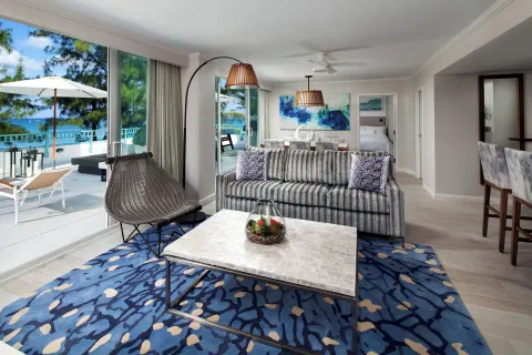 Suite lounge with terrace and ocean view at The Westin Grand Cayman Seven Mile Beach Resort & Spa.