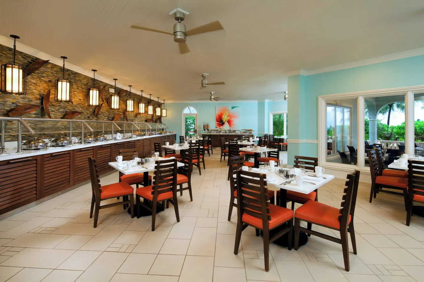 Buffet dining room with set tables at The Westin Grand Cayman Seven Mile Beach Resort & Spa.