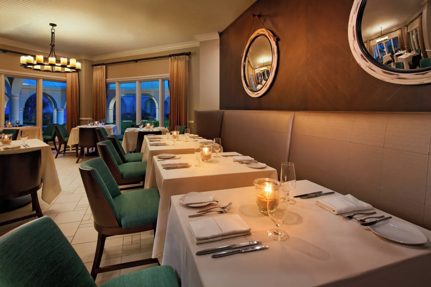 Candlelit indoor dining room at The Westin Grand Cayman Seven Mile Beach Resort & Spa.