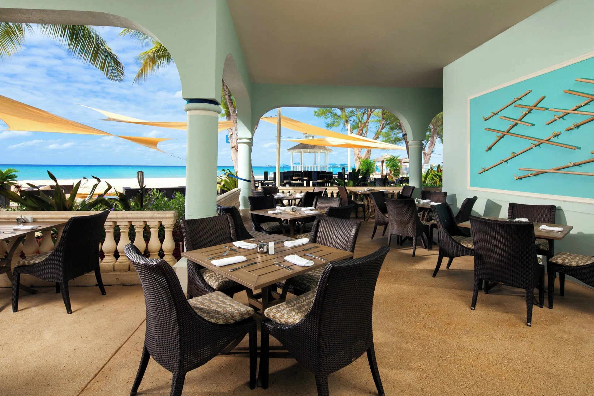 Covered beachfront dining terrace at The Westin Grand Cayman Seven Mile Beach Resort & Spa.