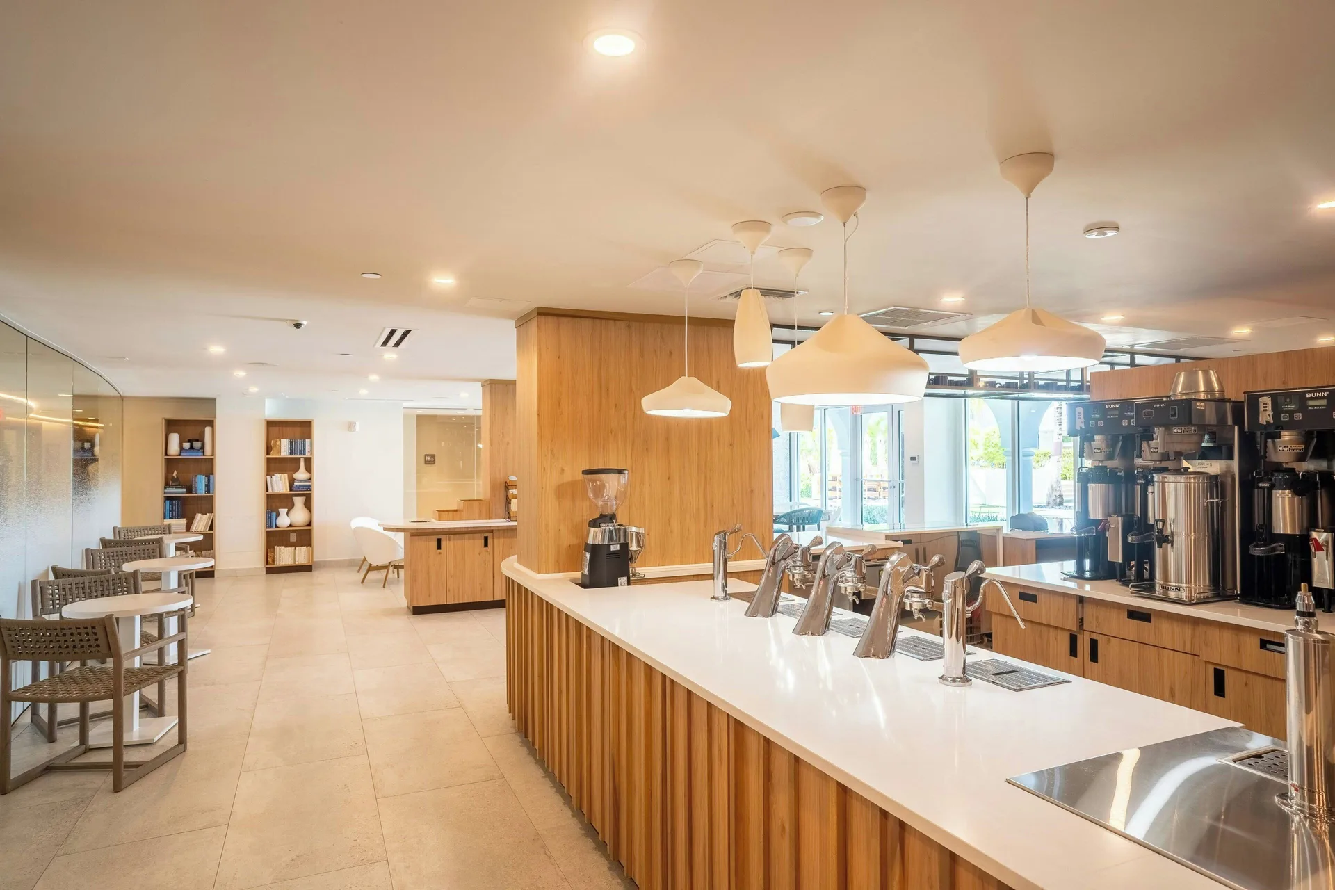 Bright coffee bar with taps and seating at The Westin Grand Cayman Seven Mile Beach Resort & Spa.