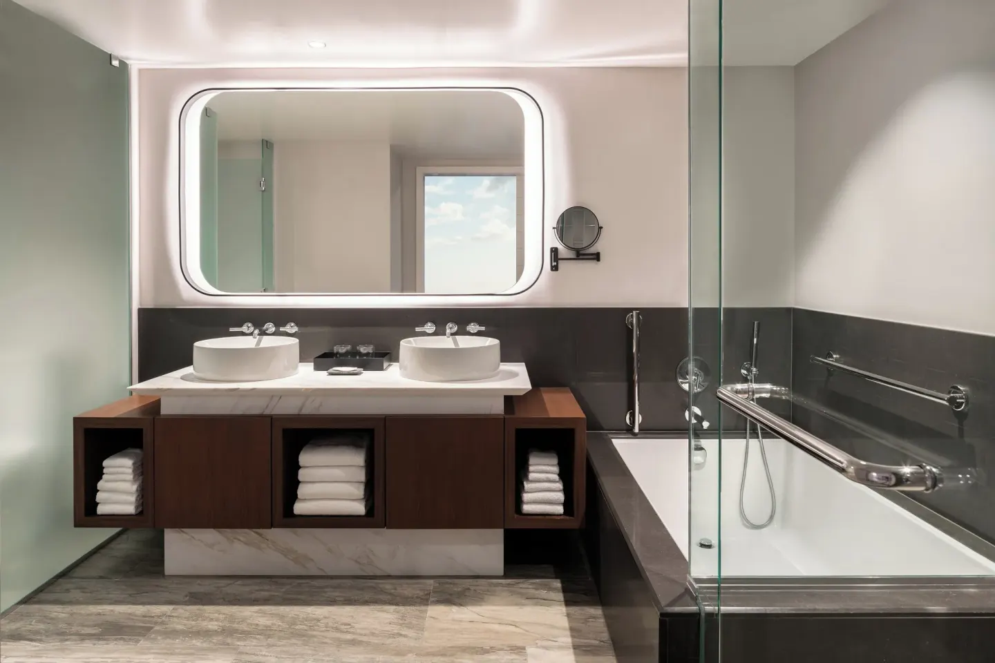 Guest bathroom with double vessel sinks and glass shower at The Westin Maui Resort & Spa, Ka'anapali.