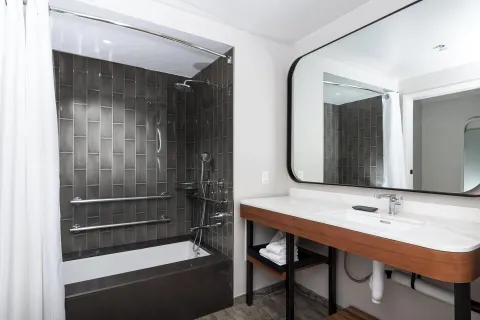 Guest bathroom with tub-shower and vanity at The Westin Maui Resort & Spa, Ka'anapali.
