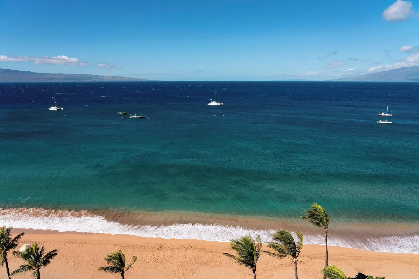 Ka'anapali Beach and blue ocean with sailboats at The Westin Maui Resort & Spa, Ka'anapali.