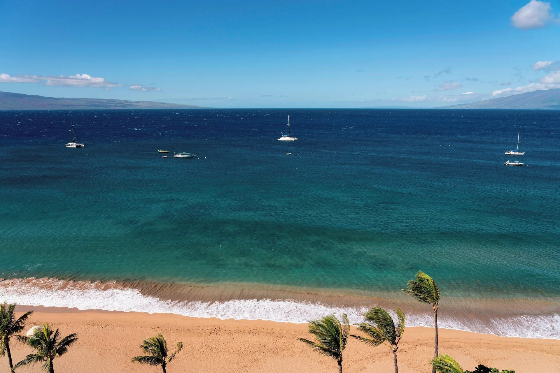 Ka'anapali Beach and blue ocean with sailboats at The Westin Maui Resort & Spa, Ka'anapali.