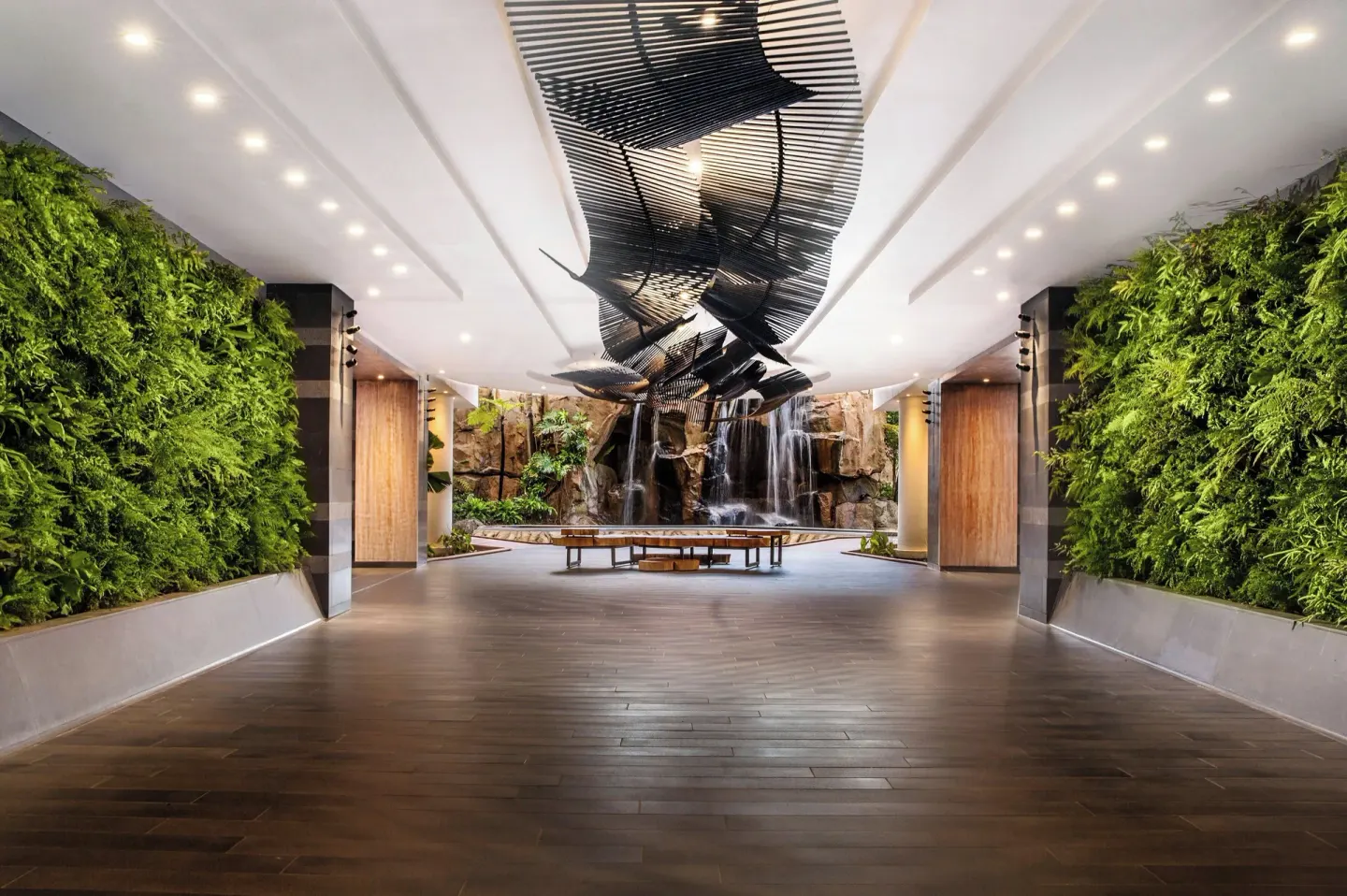 Lobby corridor with living walls and waterfall backdrop at The Westin Maui Resort & Spa, Ka'anapali.