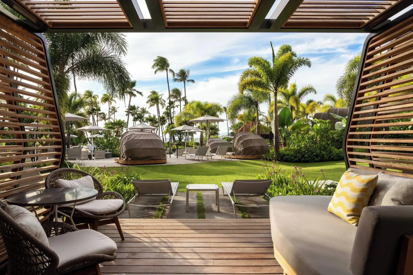 Shaded poolside cabana and lawn seating at The Westin Maui Resort & Spa, Ka'anapali.