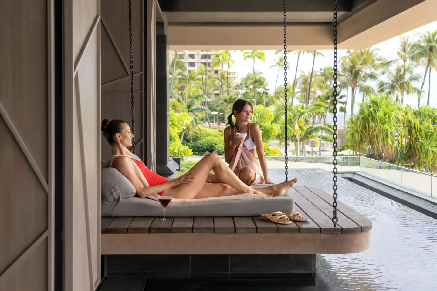 Guests relax on a suspended spa daybed at The Westin Maui Resort & Spa, Ka'anapali.