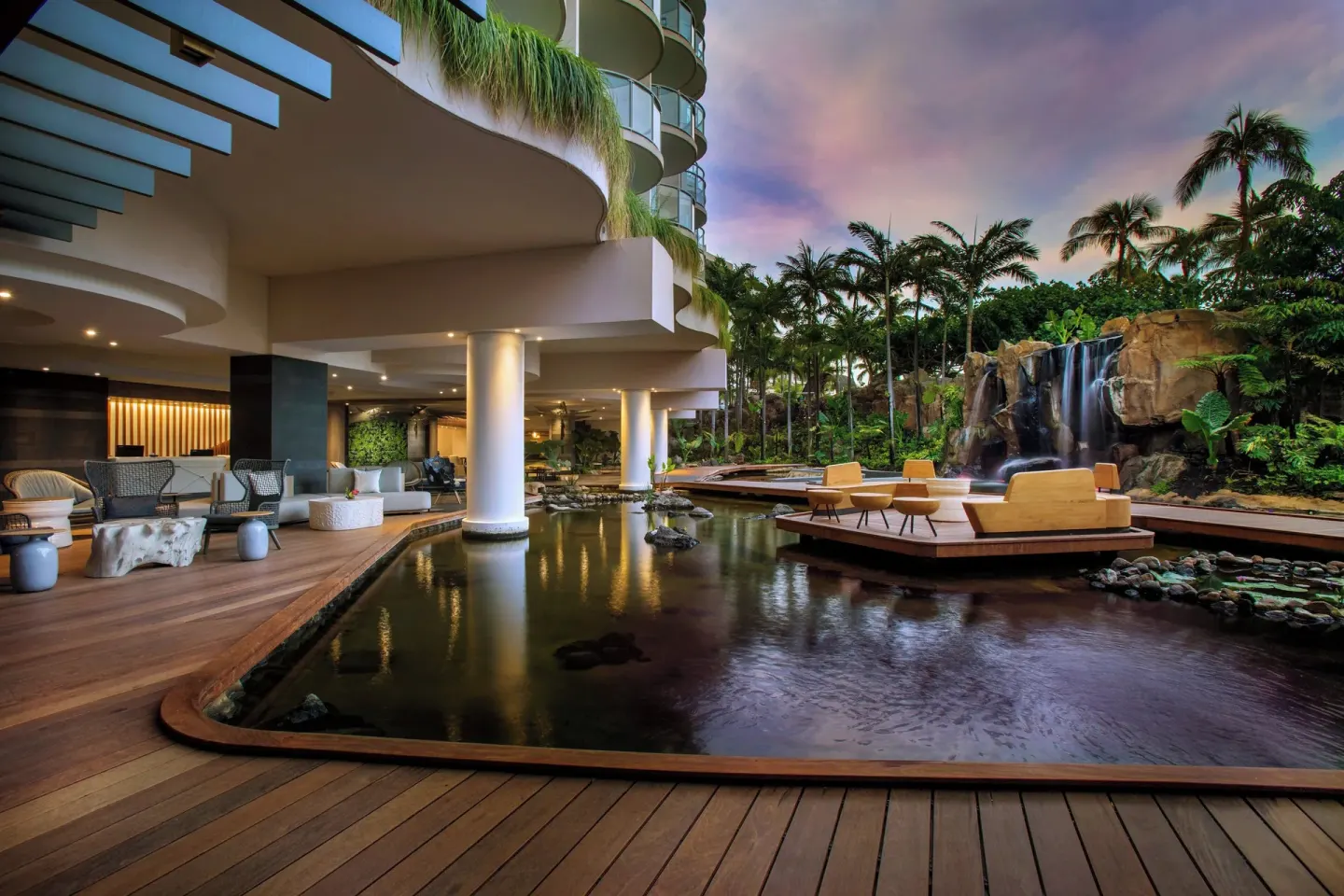 Outdoor lounge deck with reflecting pond and waterfall at The Westin Maui Resort & Spa, Ka'anapali.