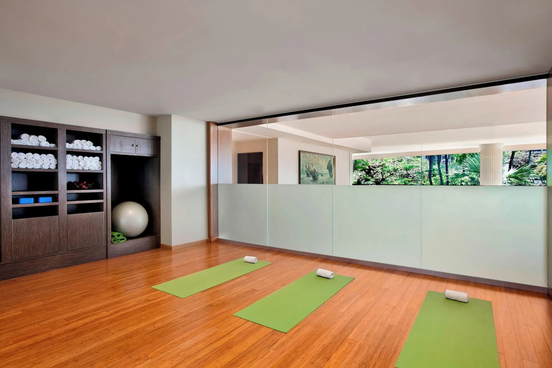 Yoga studio with green mats and towels at The Westin Maui Resort & Spa, Ka'anapali.