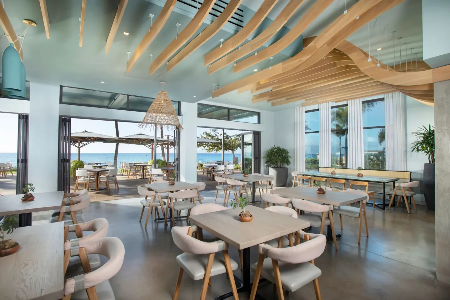Ocean-facing dining room with open doors at The Westin Maui Resort & Spa, Ka'anapali.