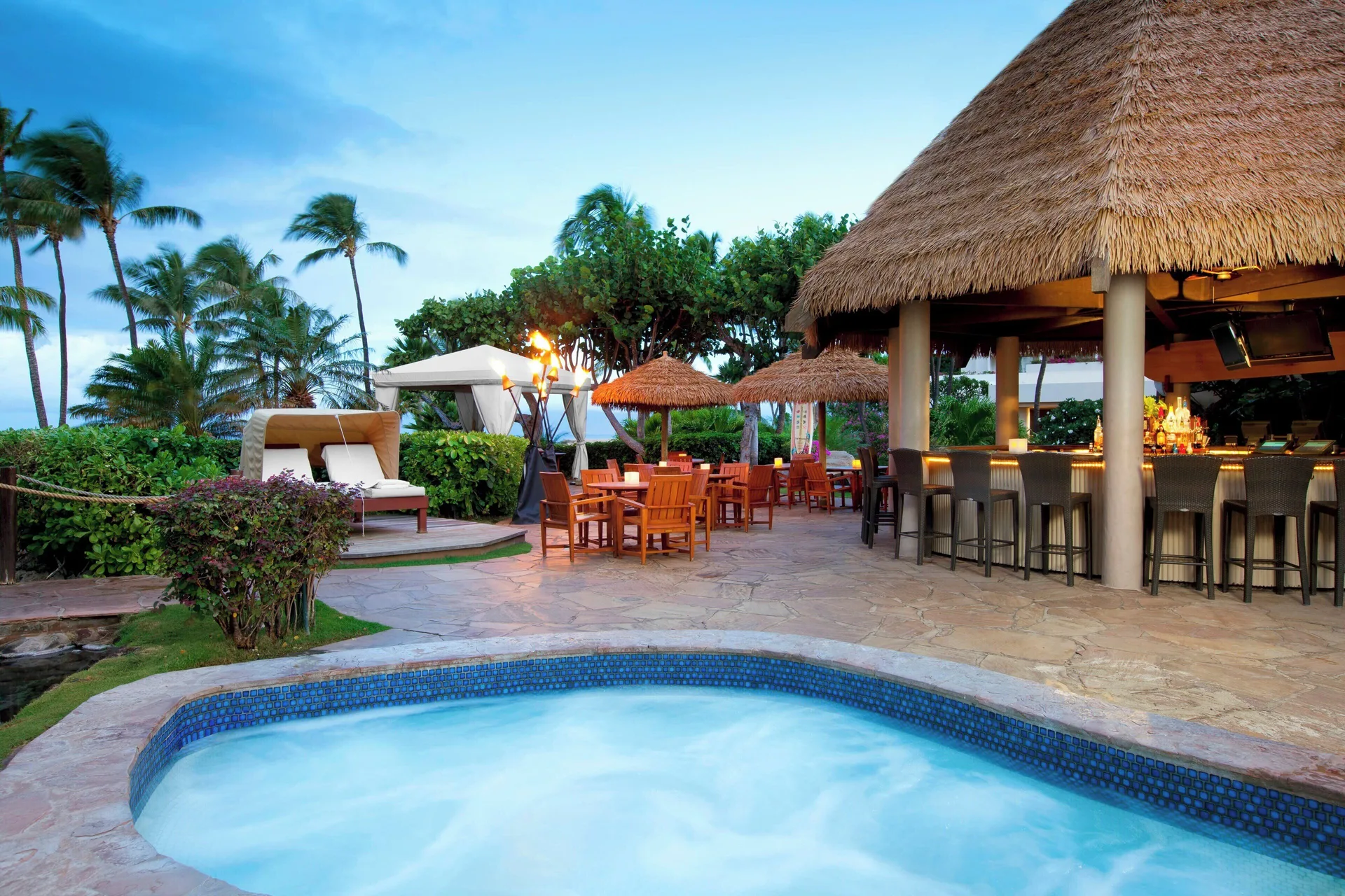 Poolside bar and whirlpool with thatched roofs at The Westin Maui Resort & Spa, Ka'anapali.