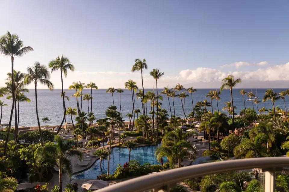 Ocean-view balcony scene with palms and pools at The Westin Maui Resort & Spa, Ka'anapali.