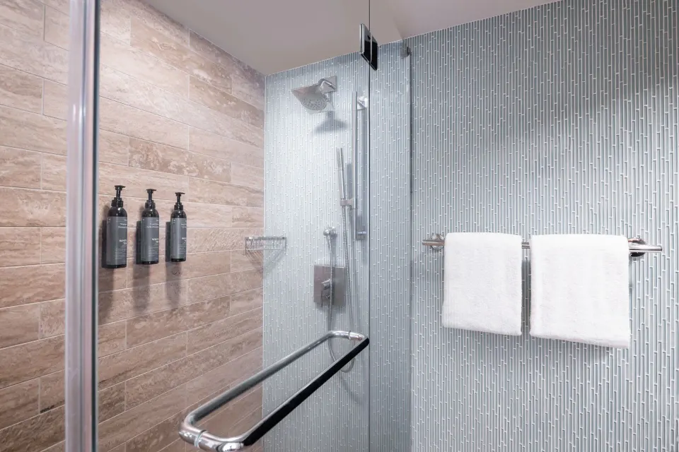 Accessible shower with grab bar and towels at The Westin Maui Resort & Spa, Ka'anapali.