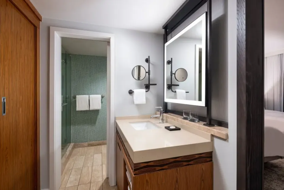 Bathroom vanity and shower entrance in a guest room at The Westin Maui Resort & Spa, Ka'anapali.