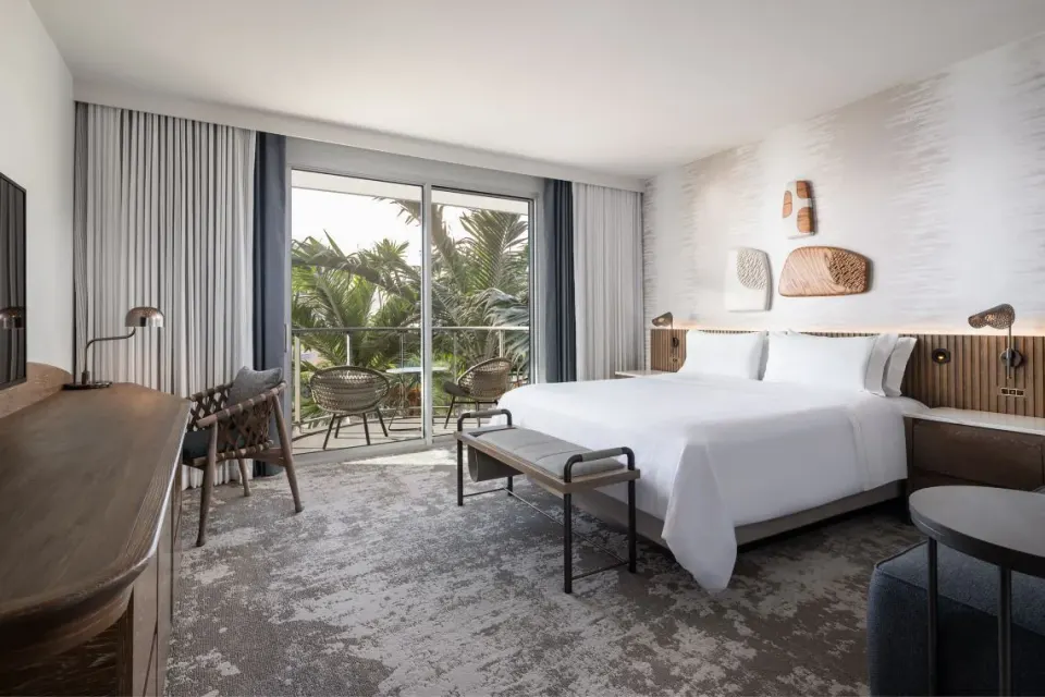 King bed guest room with palm-facing balcony at The Westin Maui Resort & Spa, Ka'anapali.