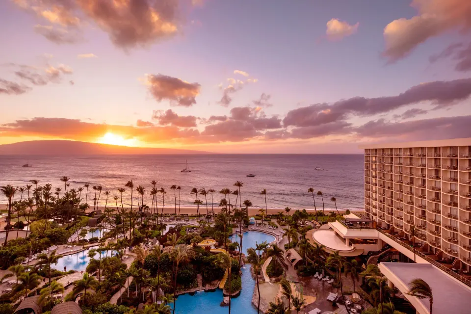 Oceanfront sunset view from The Westin Maui Resort & Spa, Ka'anapali with pools, palms, and beach.