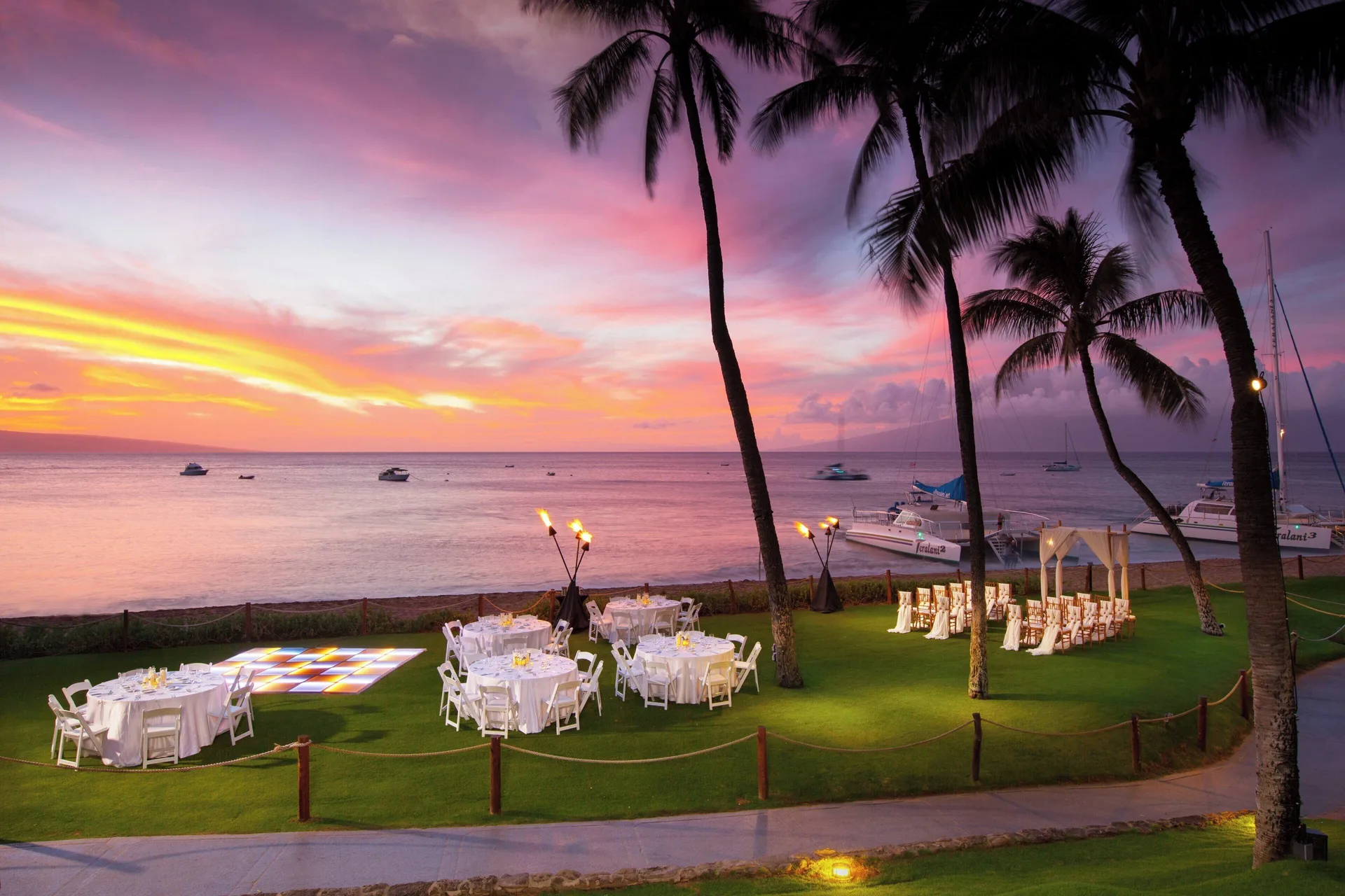 Beachfront wedding reception setup at sunset at The Westin Maui Resort & Spa, Ka'anapali.