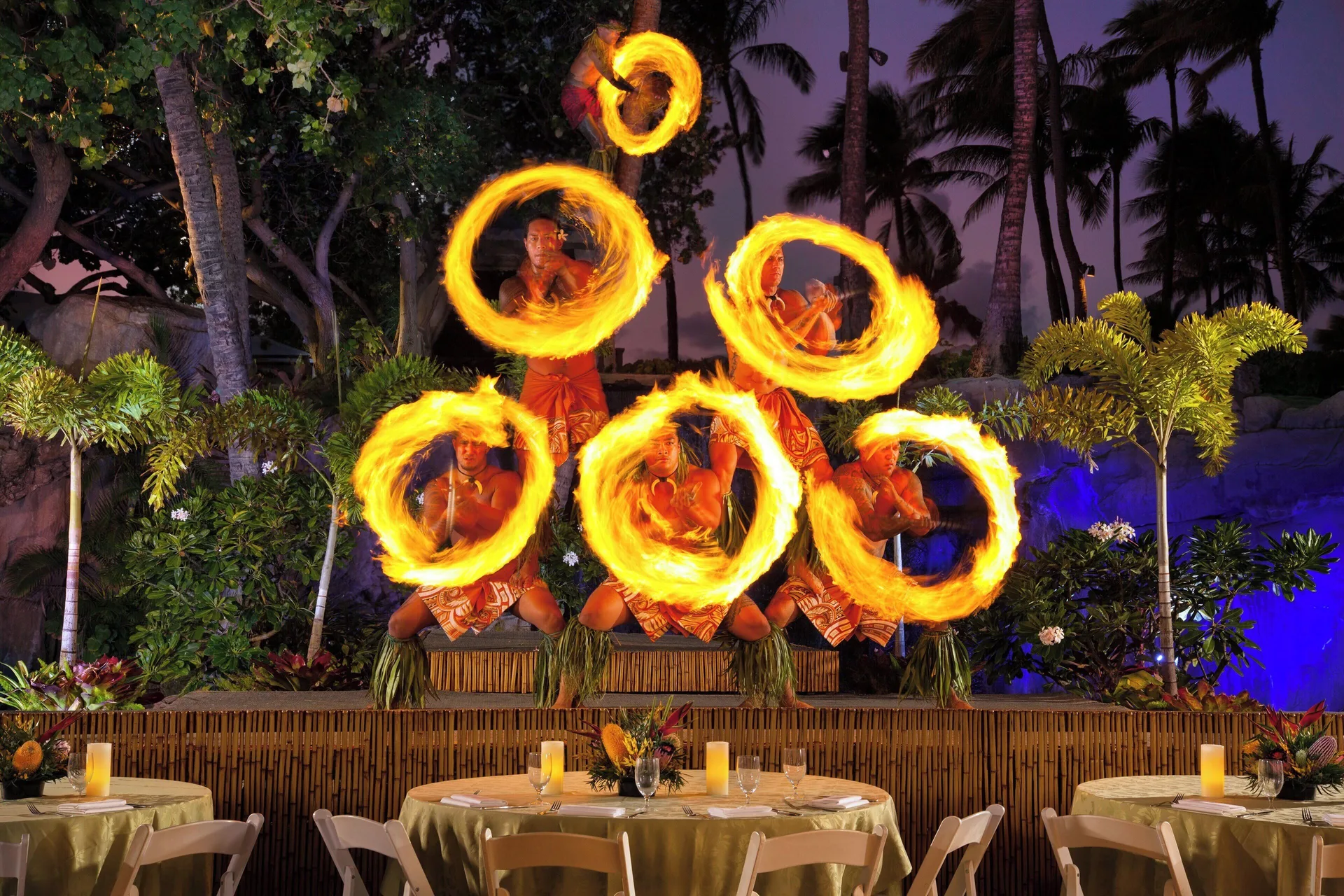 Fire dancers perform at an outdoor luau at The Westin Maui Resort & Spa, Ka'anapali.