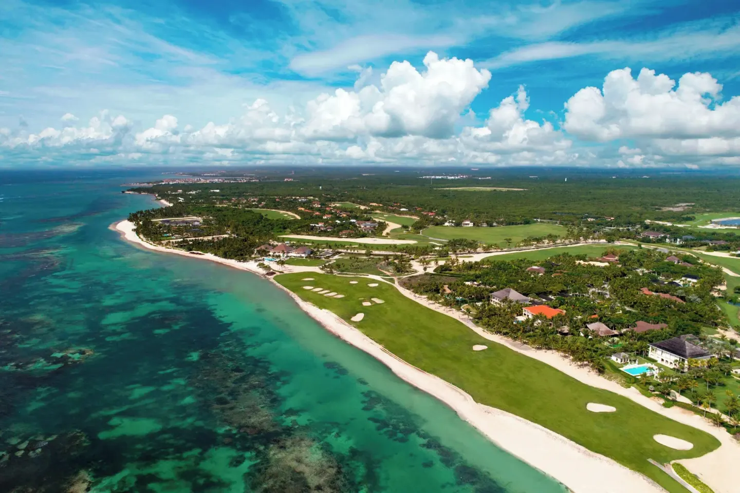 An aerial view shows the beach, golf course, and resort grounds at The Westin Puntacana Resort.