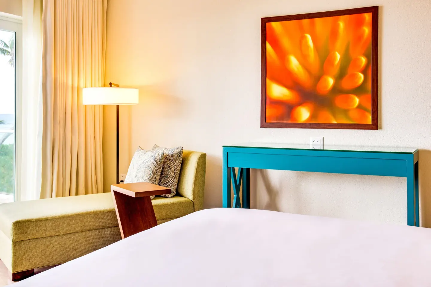 Guest room sitting area and bed at The Westin Puntacana Resort.