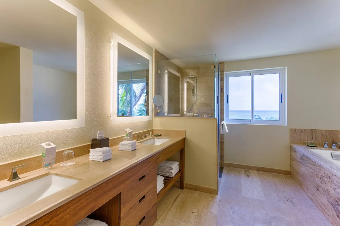 Junior Suite bathroom with double vanity and ocean-facing window at The Westin Puntacana Resort.