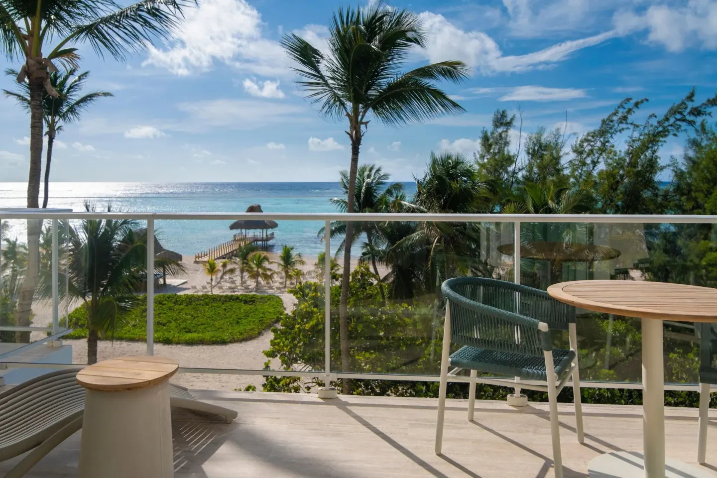 Furnished ocean-view balcony of a Junior Suite at The Westin Puntacana Resort.