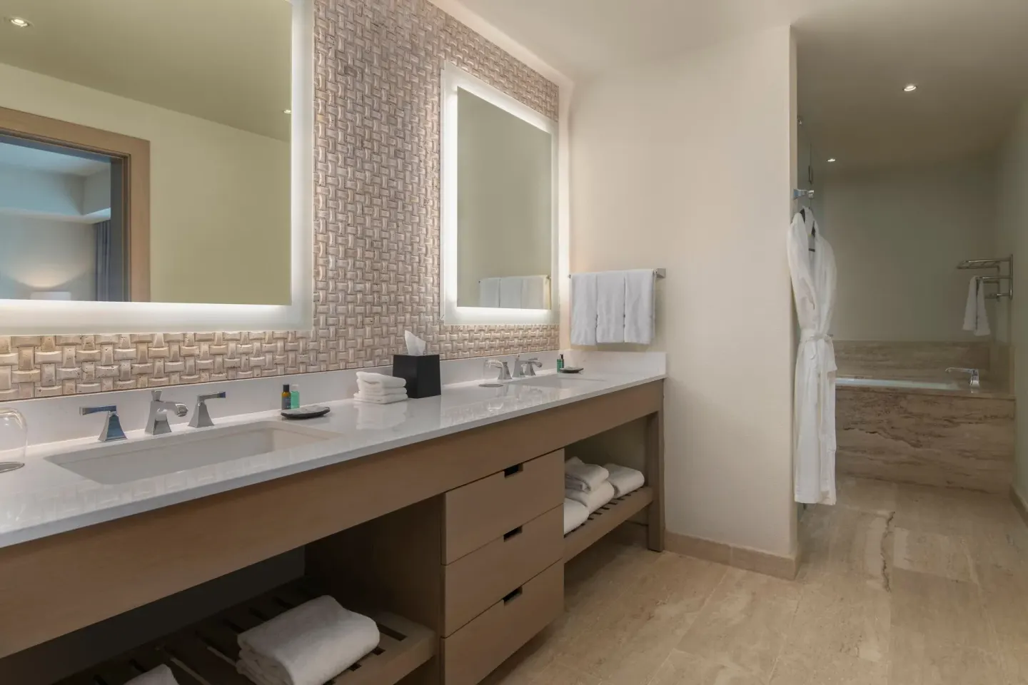 One-bedroom suite bathroom with double vanity and tub at The Westin Puntacana Resort.