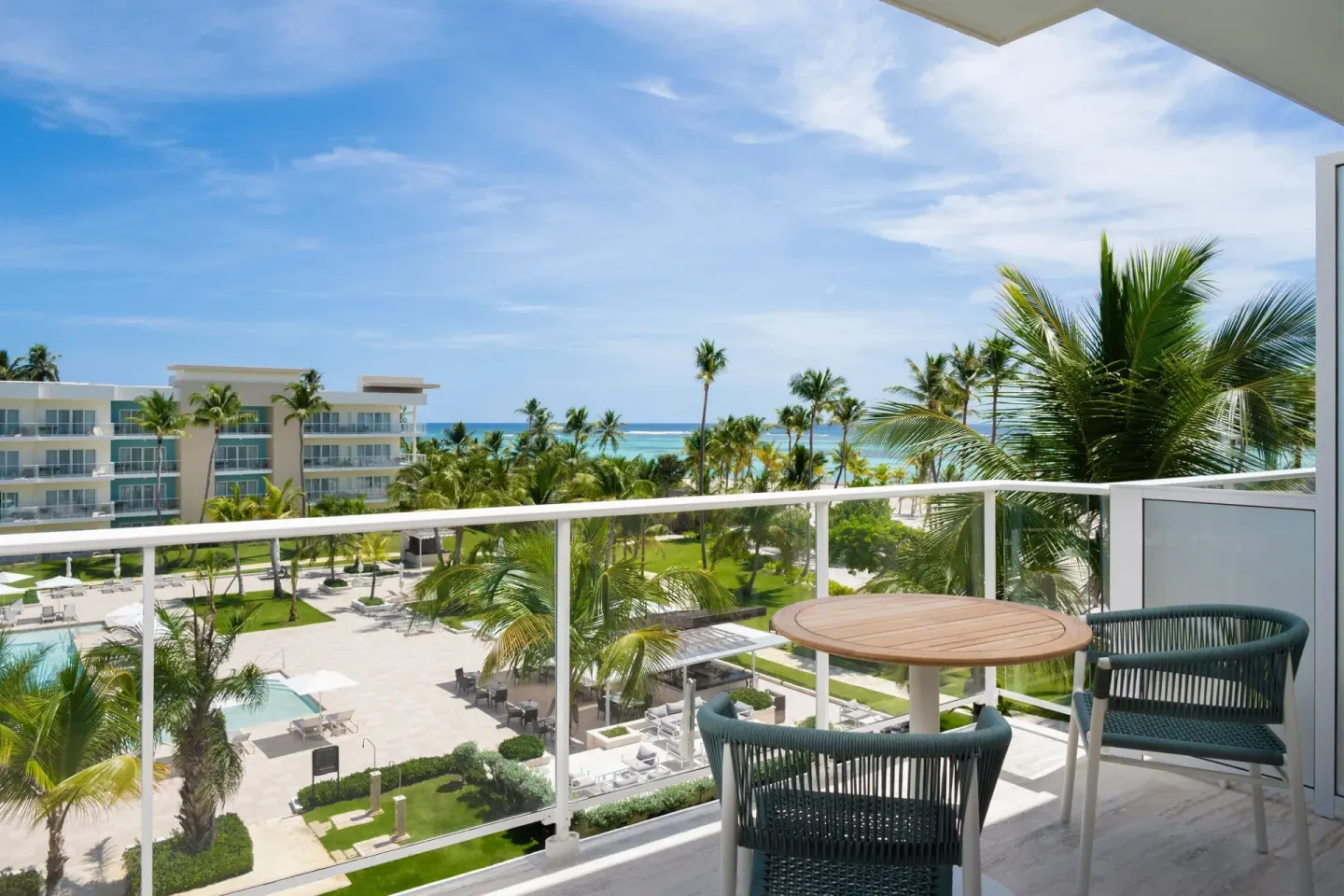 Traditional Room balcony with table, chairs and ocean view at The Westin Puntacana Resort.