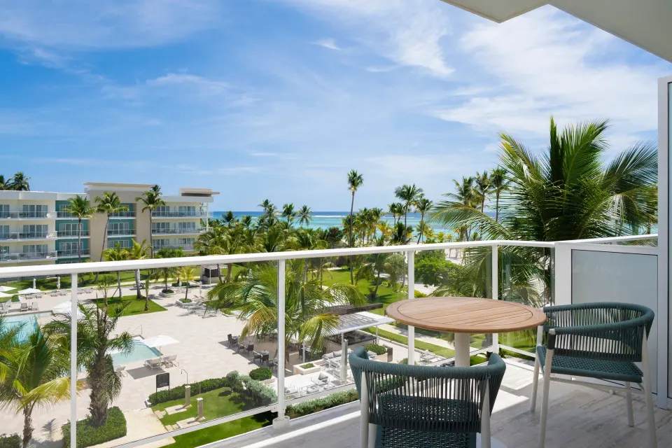 Traditional Room balcony with table, chairs and ocean view at The Westin Puntacana Resort.