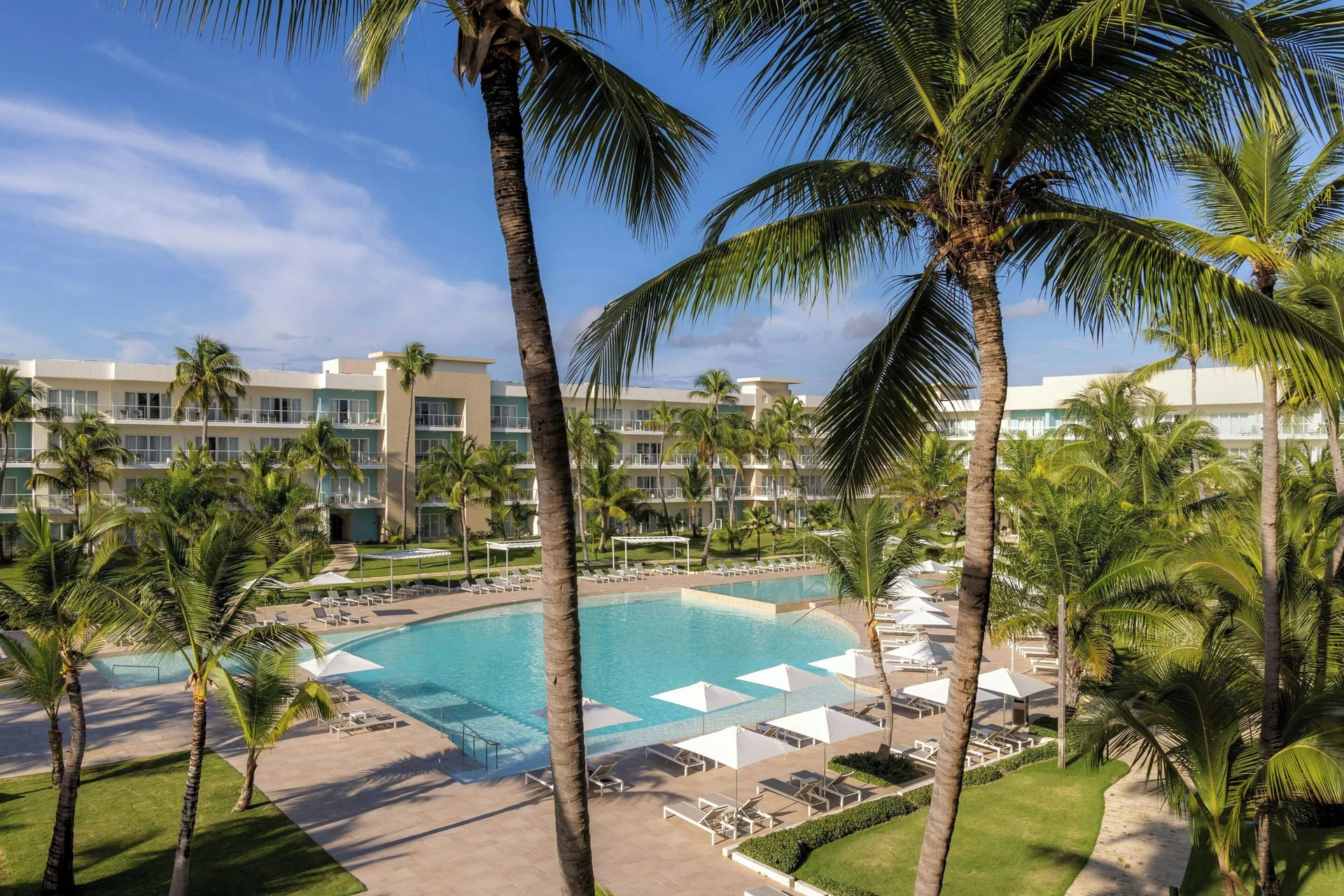 Ocean-view room outlook over the main pool and palms at The Westin Puntacana Resort.