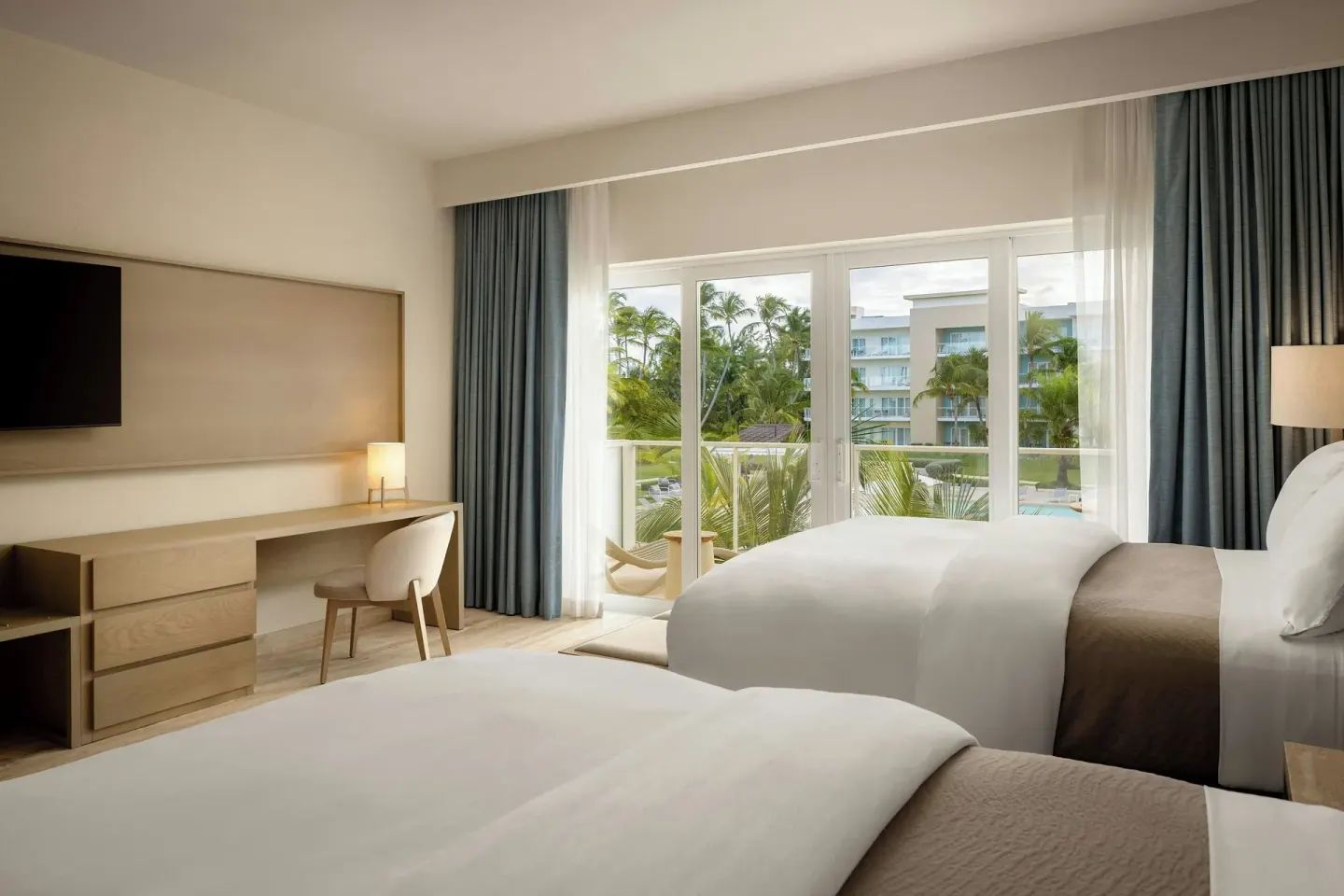 Traditional Room with two beds, desk and balcony at The Westin Puntacana Resort.