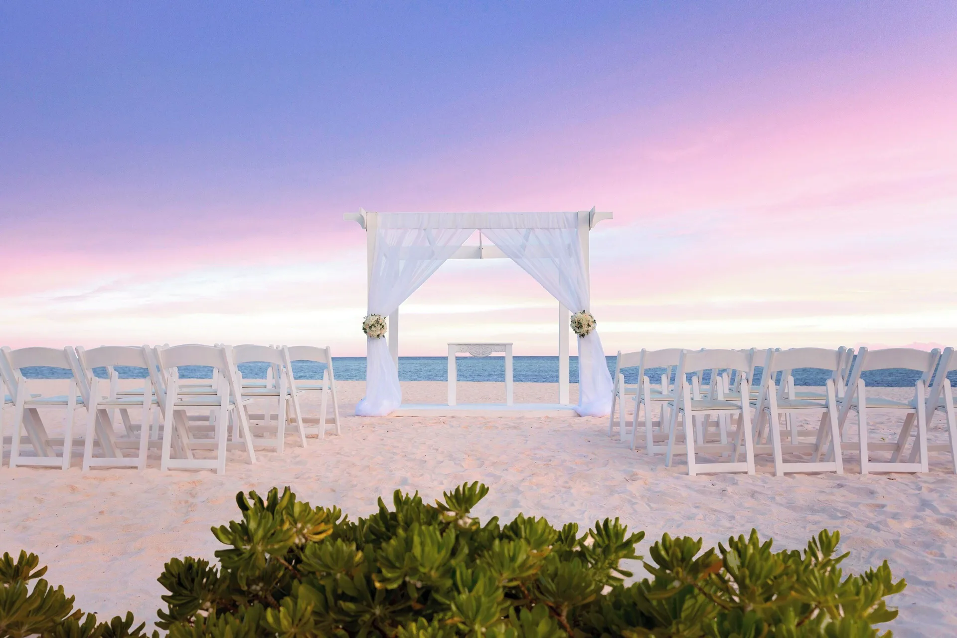 Beach wedding ceremony setup facing the ocean at The Westin Puntacana Resort.