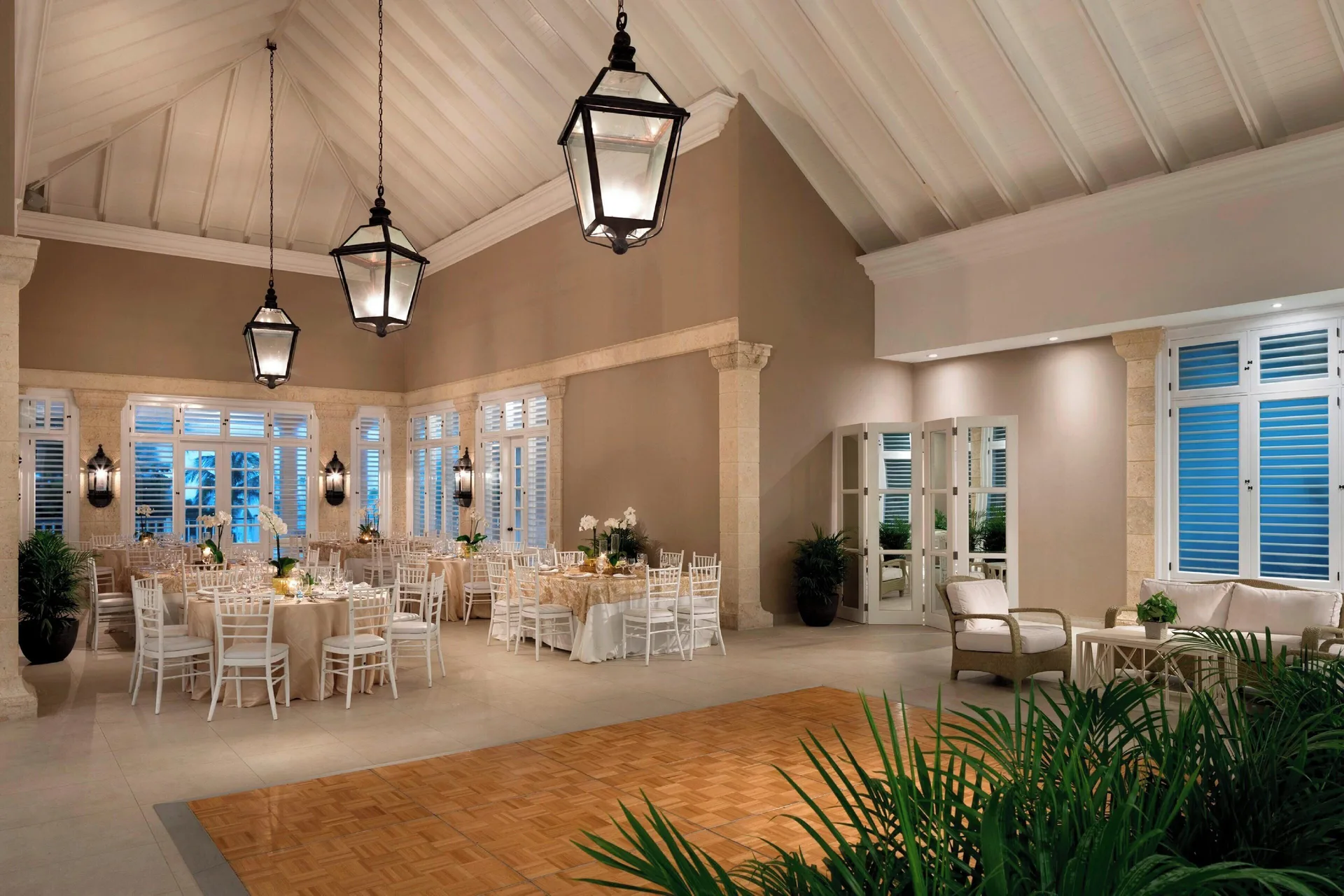 Event room with banquet tables and dance floor at The Westin Puntacana Resort.