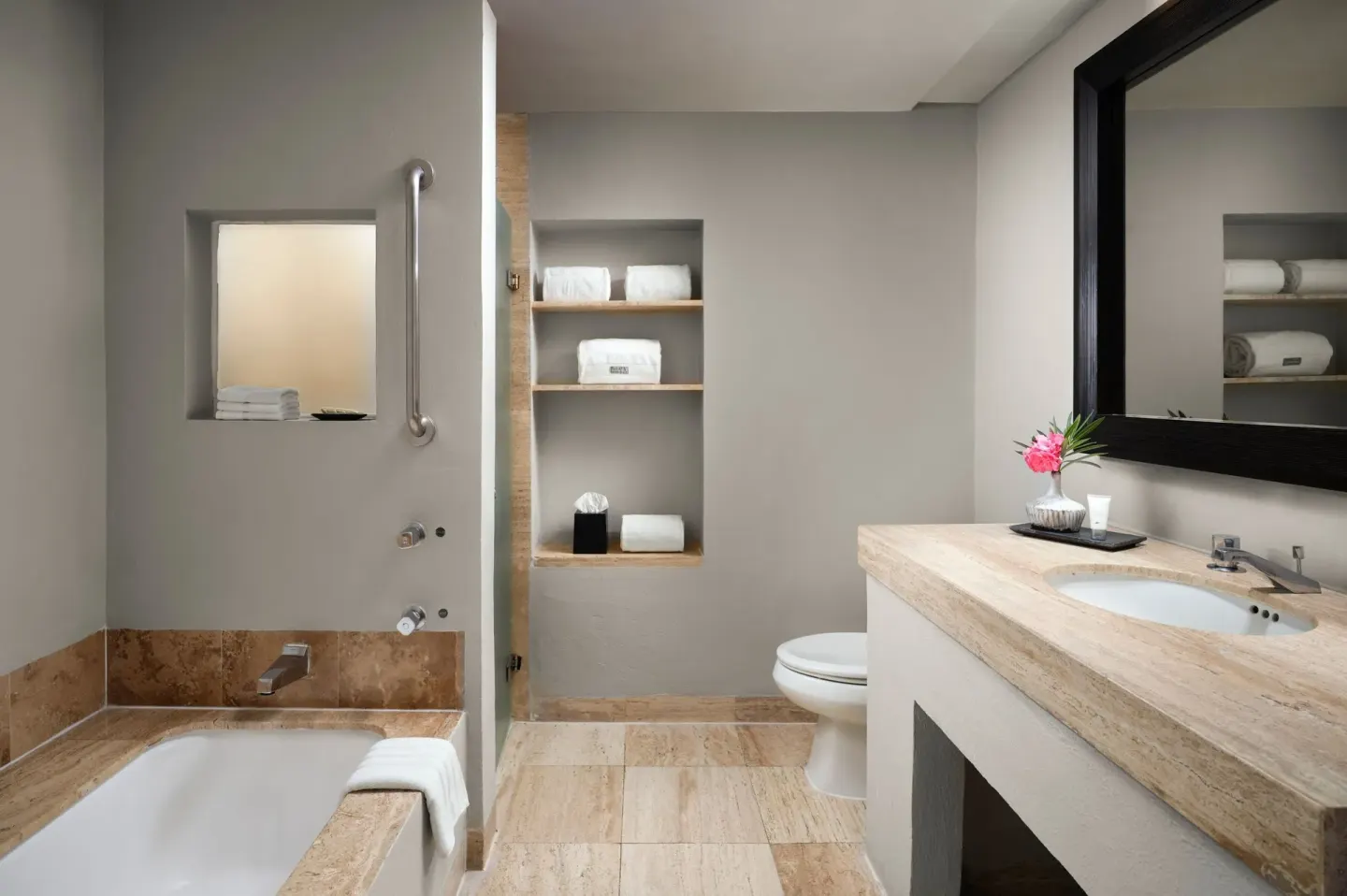 Guest bathroom with bathtub, vanity, and open shelves at The Westin Resort & Spa, Cancun.