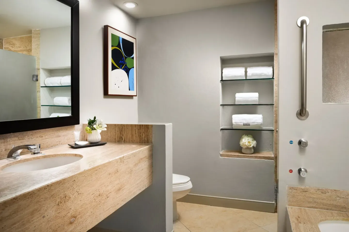 Guest bathroom with vanity, shower, and towel shelves at The Westin Resort & Spa, Cancun.