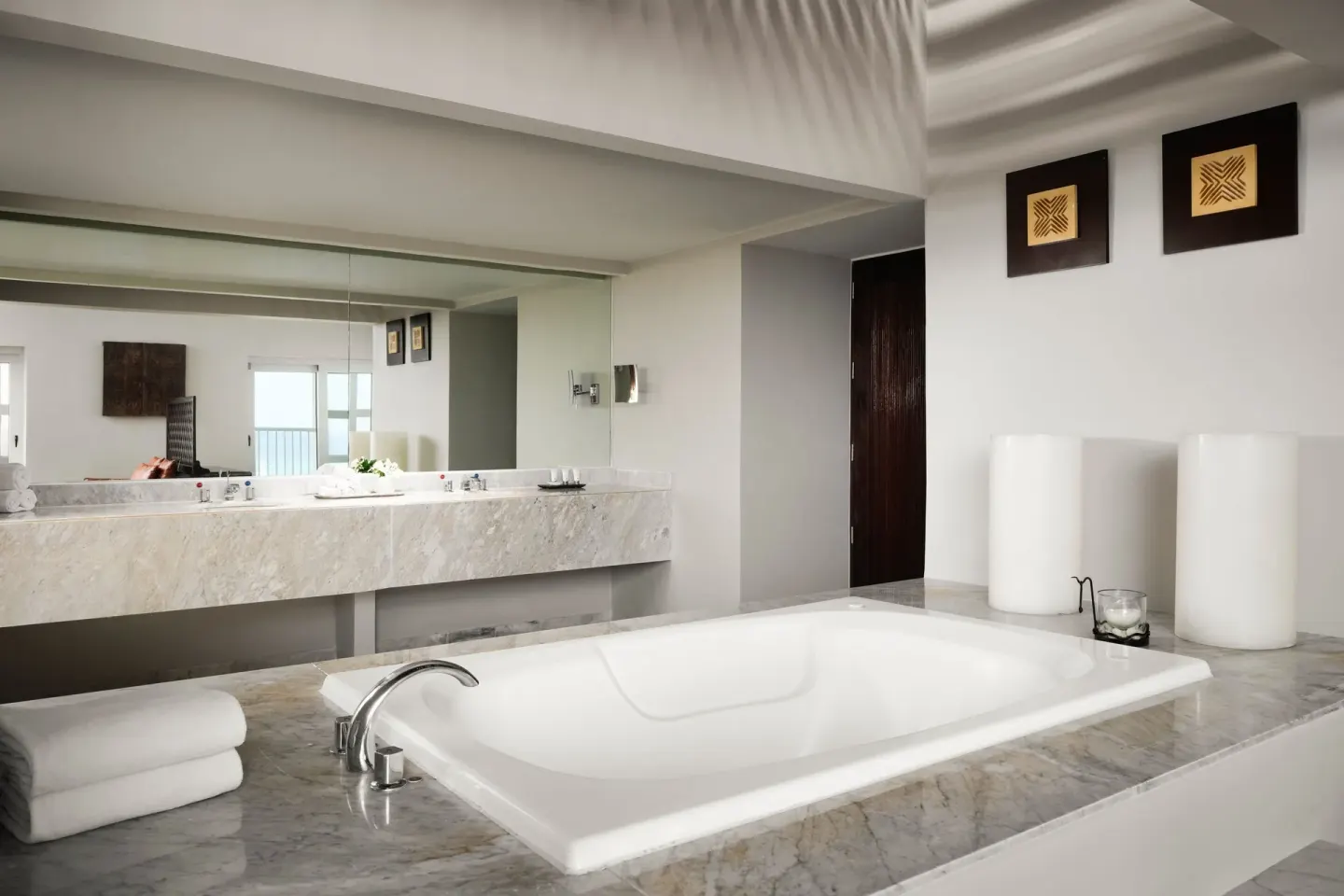 Marble bathroom with soaking tub and mirror at The Westin Resort & Spa, Cancun.
