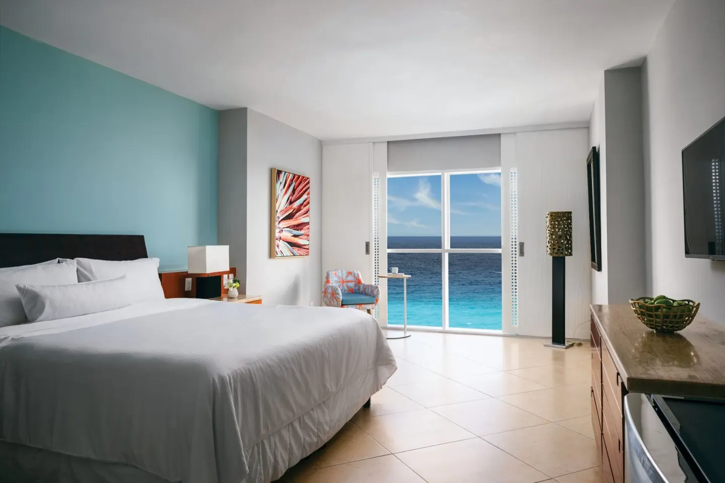 Ocean-view king room with seating area at The Westin Resort & Spa, Cancun.