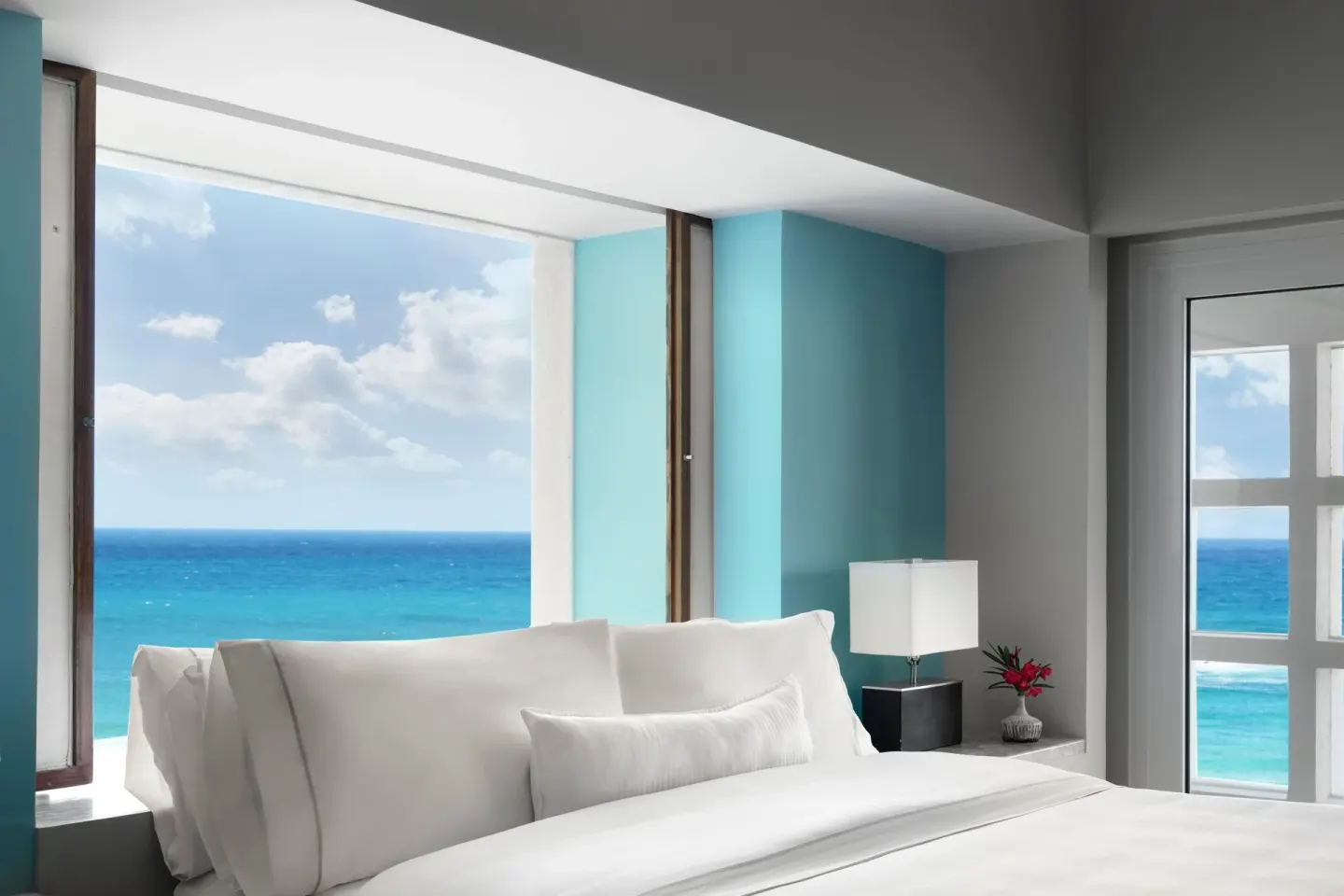 Ocean-view king bed with white linens at The Westin Resort & Spa, Cancun.