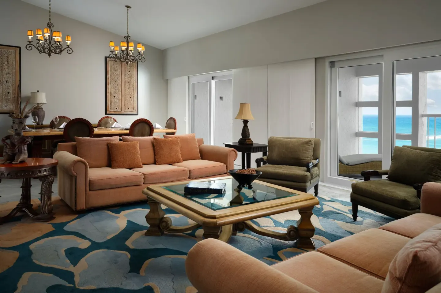 Living and dining room with ocean-facing windows at The Westin Resort & Spa, Cancun.