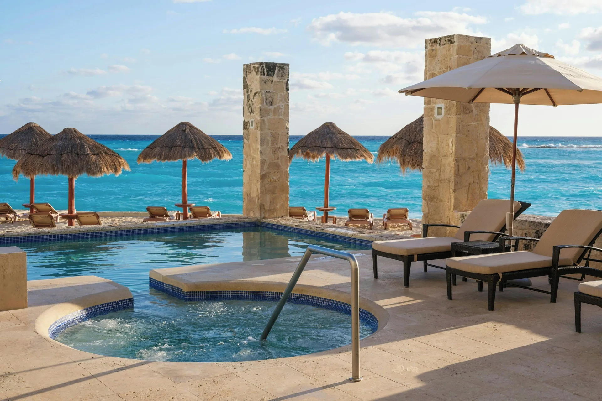 Whirlpool, pool and beach palapas facing the ocean at The Westin Resort & Spa, Cancun.