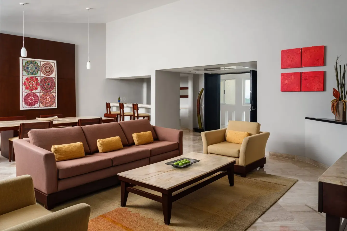 Open living and dining area with sofa at The Westin Resort & Spa, Cancun.