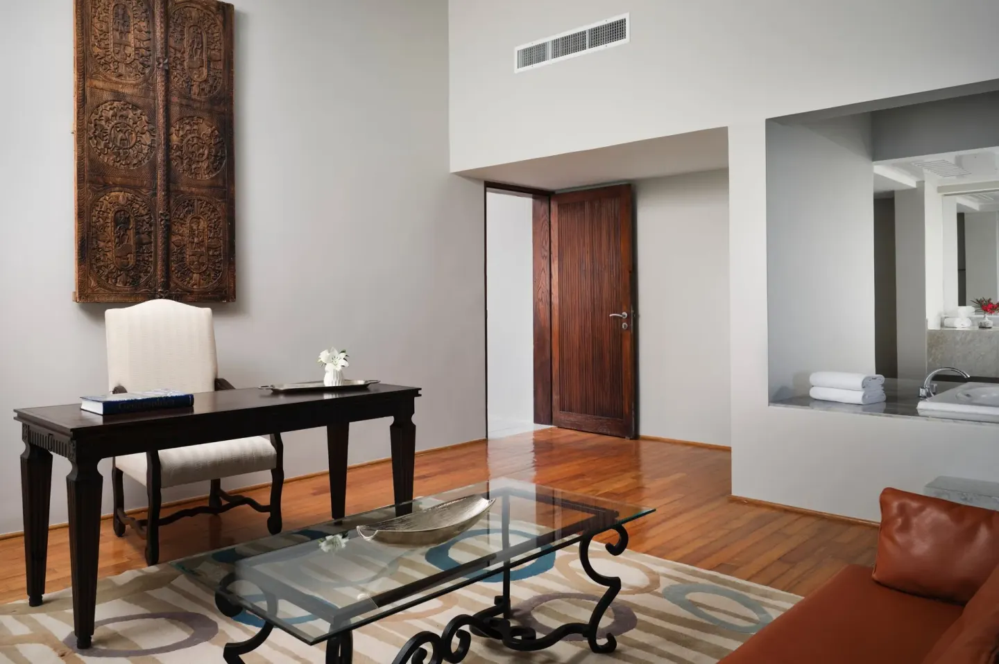 Suite sitting area with desk and open vanity at The Westin Resort & Spa, Cancun.