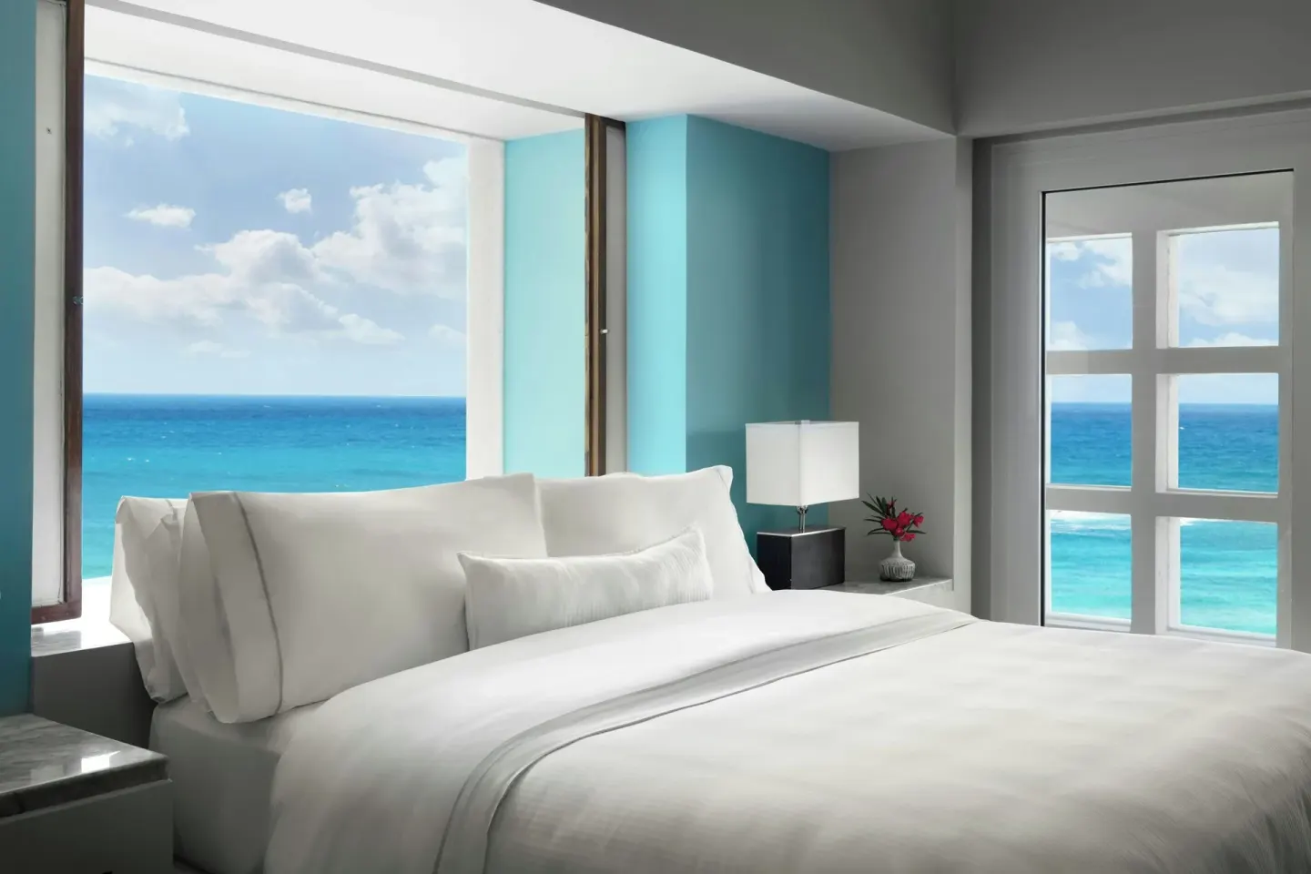 Presidential Suite king bed with ocean-facing windows at The Westin Resort & Spa, Cancun.