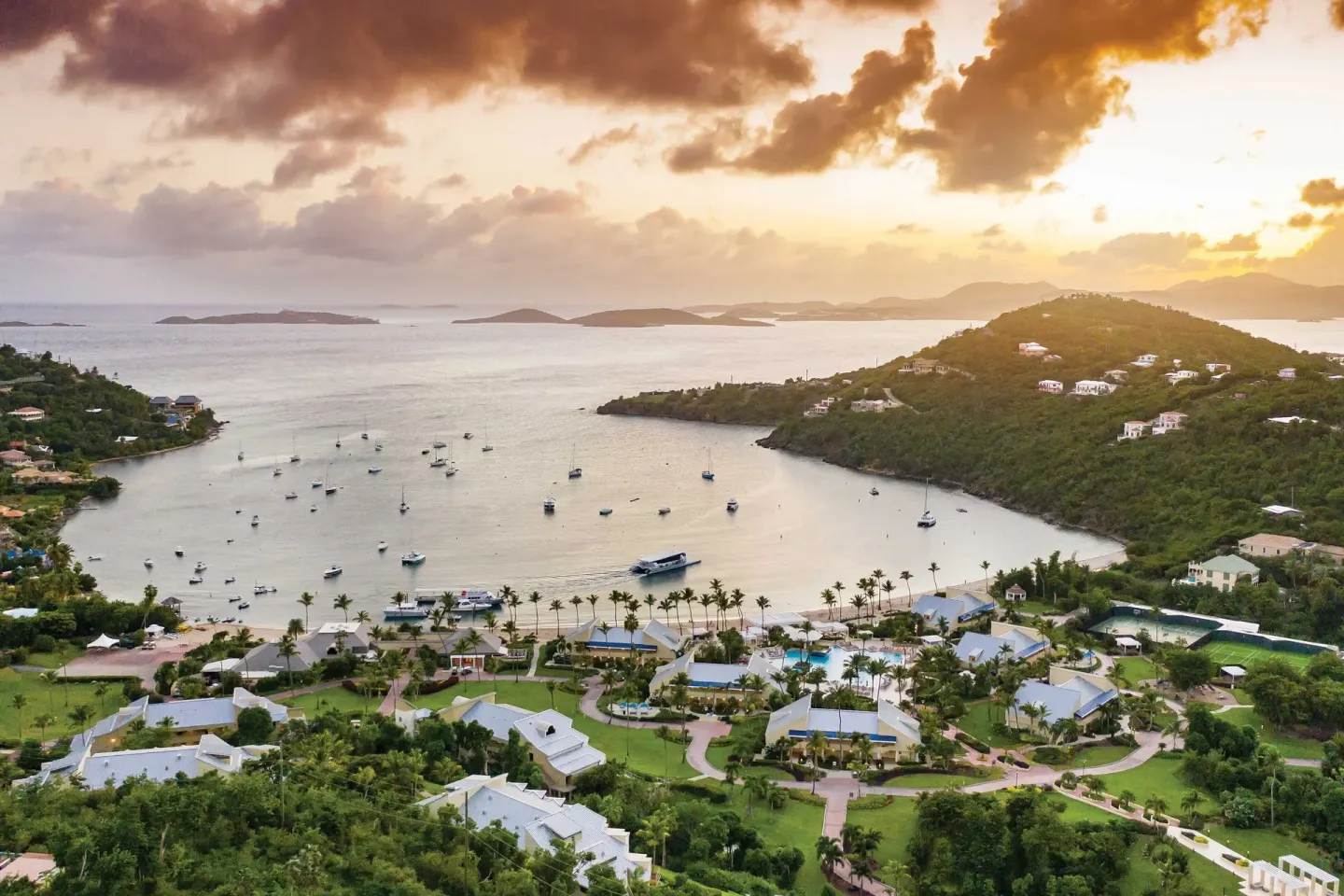 Aerial sunset view of the bay and resort at The Westin St. John Resort Villas.